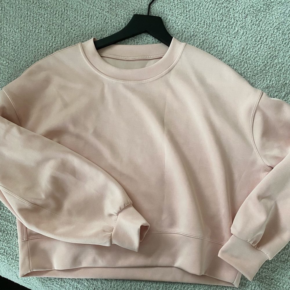 Women’s Lululemon Perfectly Oversized Crop Crew. Size 6. It is light pink.